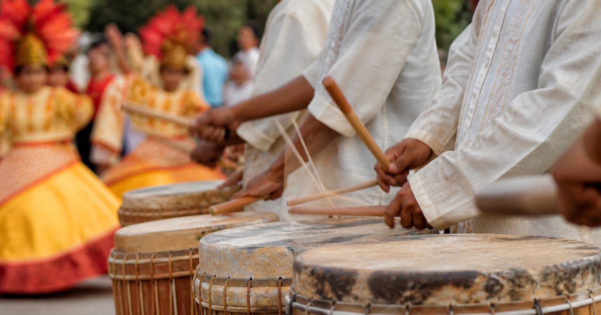 Traditional hand drums played during an outdoor community procession in Loboc