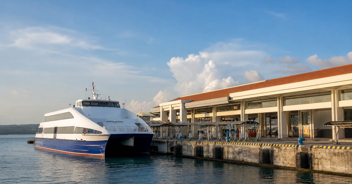 Fast passenger ferry docked beside a practical port terminal in Tagbilaran