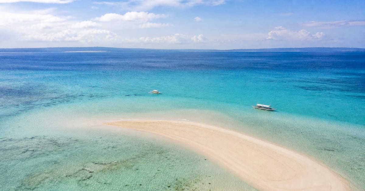 Curving Pungtud sandbar at low tide in shallow turquoise water off Panglao